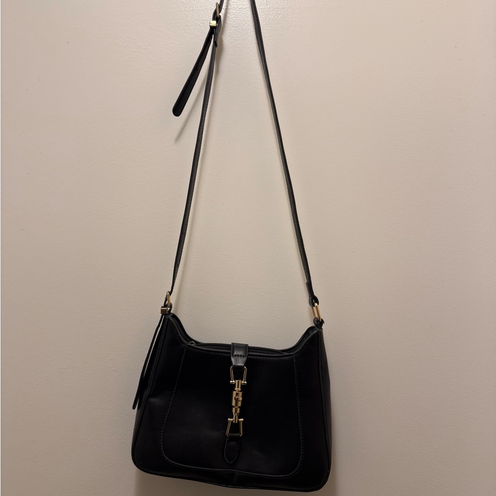 Chic Black Crossbody Bag with Gold Accents
